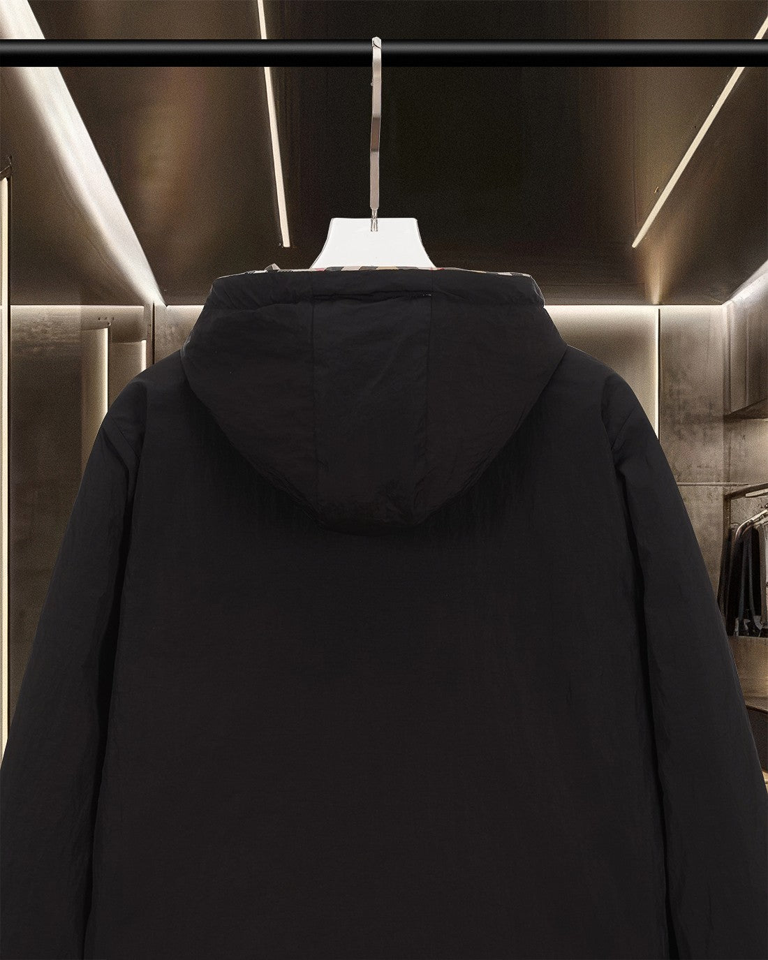 Black hooded long jacket back view with attached hood and zipper front
