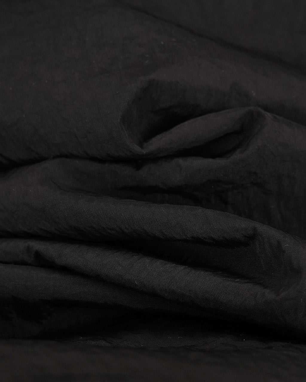 Burberry jacket fabric close-up, dark woven texture