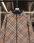 Burberry plaid hooded jacket with black zip, drawstring hood, and chest pocket