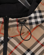 Hood drawcord detail on beige, black, and red plaid long jacket