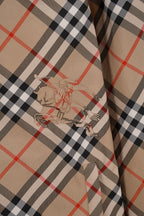 Plaid hooded jacket close-up of embroidered logo patch on the sleeve