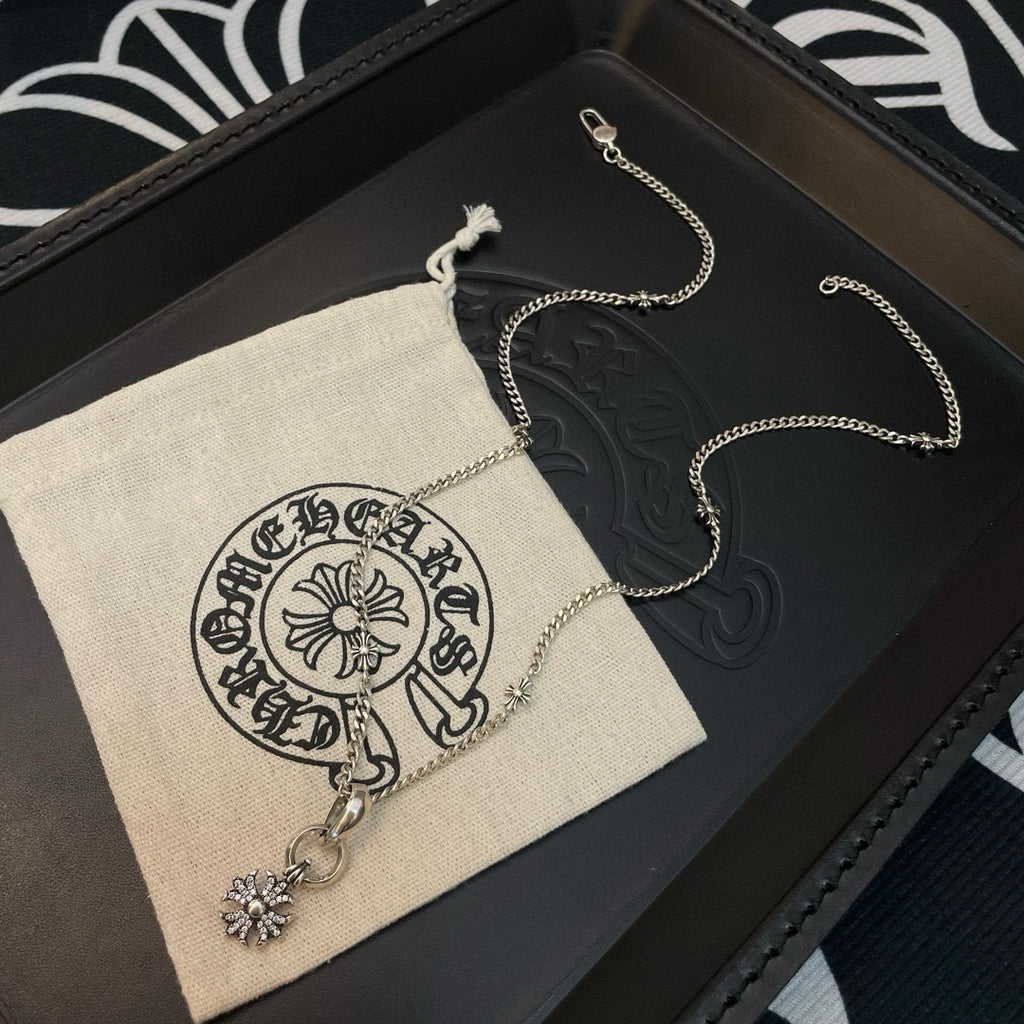 Silver-tone chain necklace with snowflake pendant and dangling charm on display set