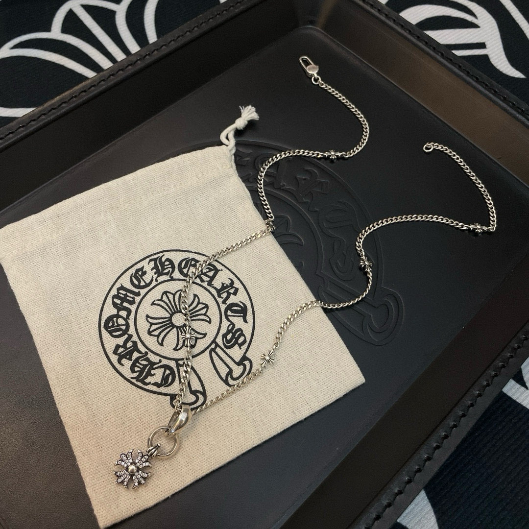 Silver-tone chain necklace with snowflake pendant and dangling charm on display set