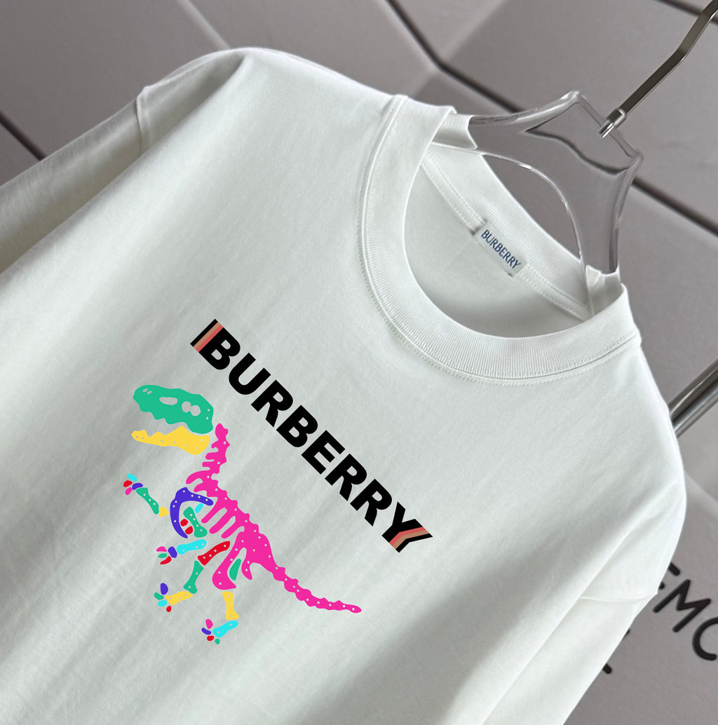 White short-sleeve T-shirt with Burberry text and multicolor dinosaur graphic