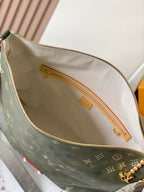 Louis Vuitton monogram canvas bag with zip top, tan lining, gold hardware