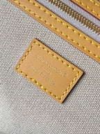 Louis Vuitton leather logo label with gold stitching and Made in France text