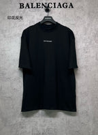 Black crewneck T-shirt with small BALENCIAGA logo on chest