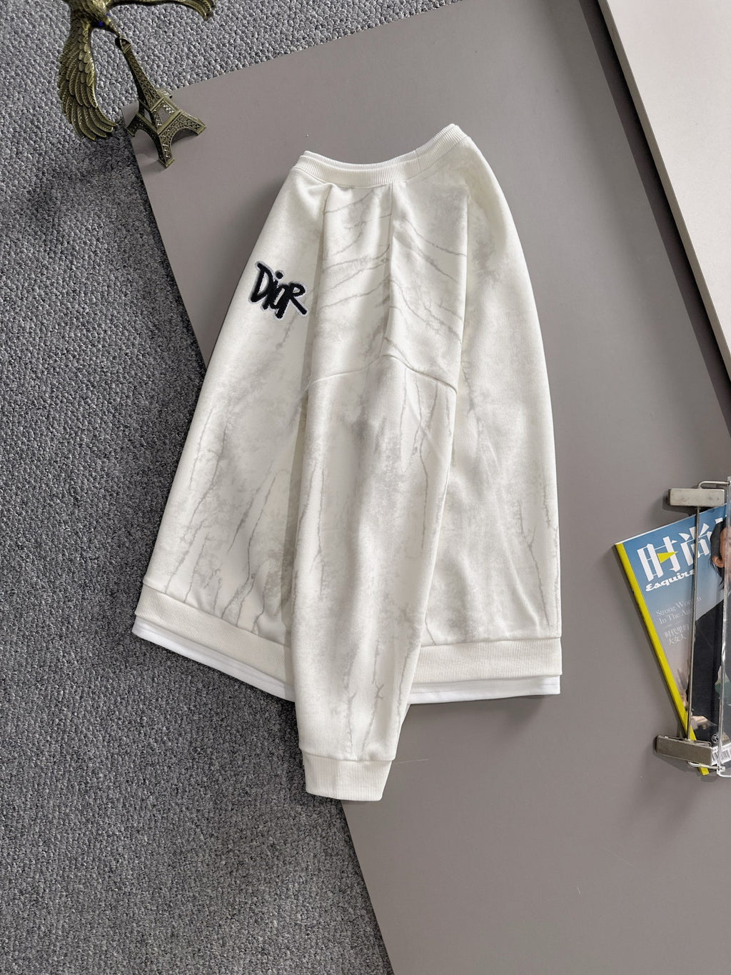 Crewneck sweatshirt back view with marbled light fabric and ribbed hem