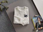 Crewneck sweatshirt with marbled light pattern and black DiR chest print, long sleeves