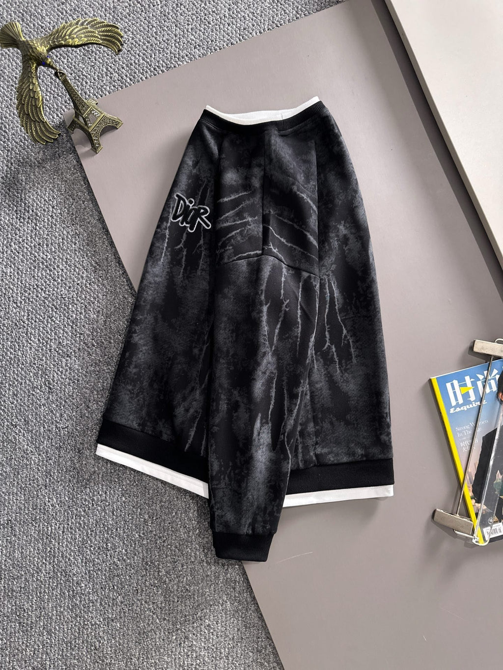 Black long-sleeve sweatshirt with diagonal tie-dye texture and DiR logo on chest