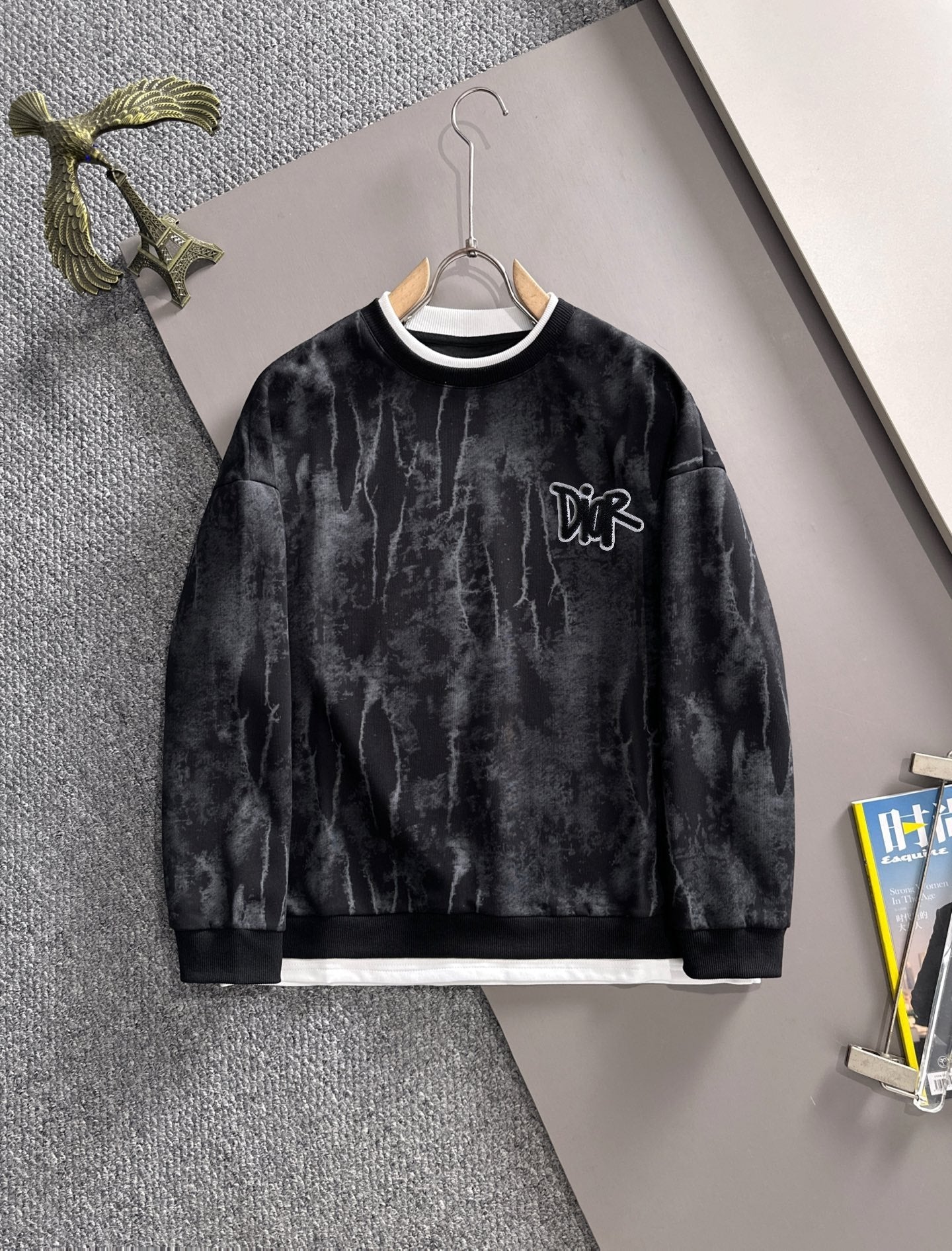 Black long-sleeve sweatshirt with white crew collar and DiR logo on chest
