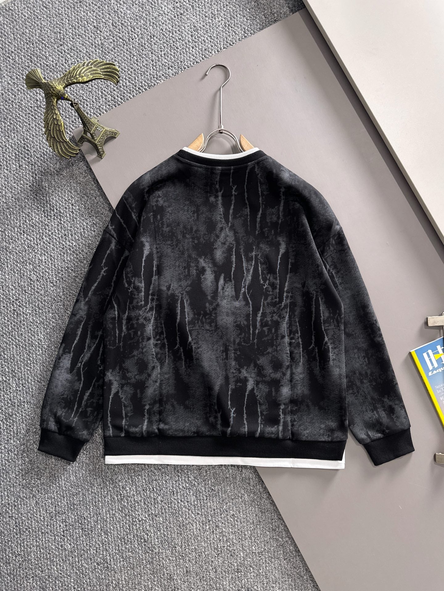 Black long-sleeve sweatshirt with white hem band and DiR logo on chest