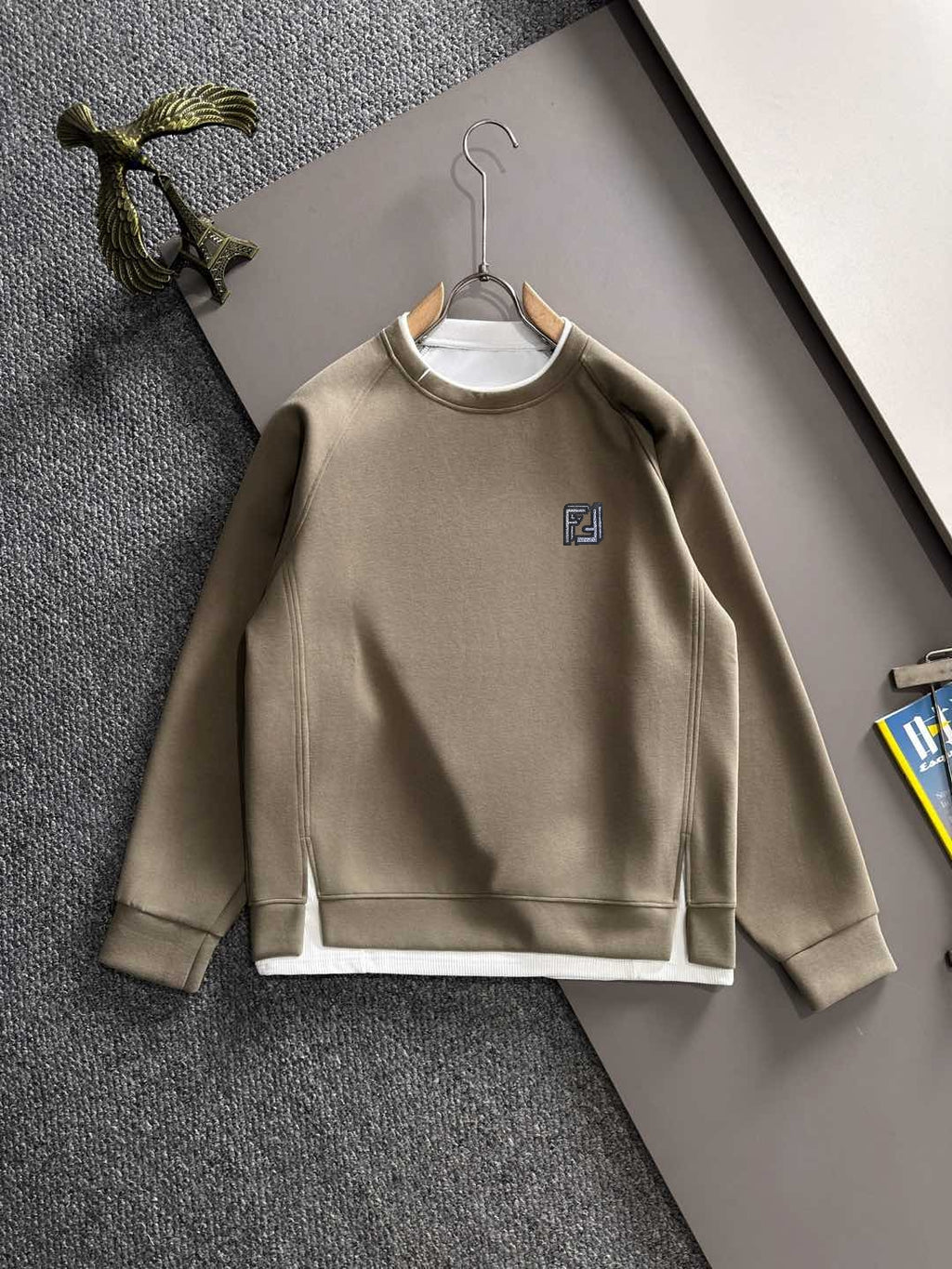 Beige long-sleeve crewneck sweatshirt with small Fendi logo on chest