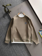 Beige long-sleeve crewneck sweatshirt with small Fendi logo on chest