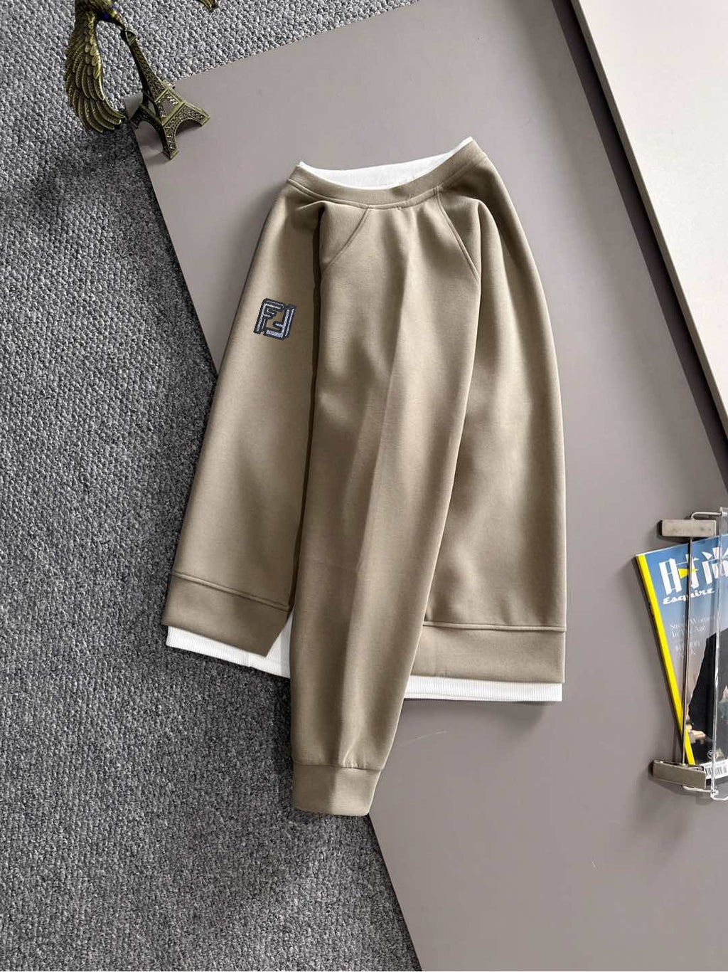 Beige crewneck sweatshirt with long sleeves and small Fendi logo patch
