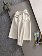 Dior long-sleeve polo shirt on hanger, light cream with collar and small chest logo