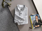Light gray long-sleeve pullover folded with stand collar and button placket