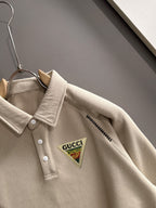 Cream long-sleeve polo shirt with point collar and Gucci logo chest patch