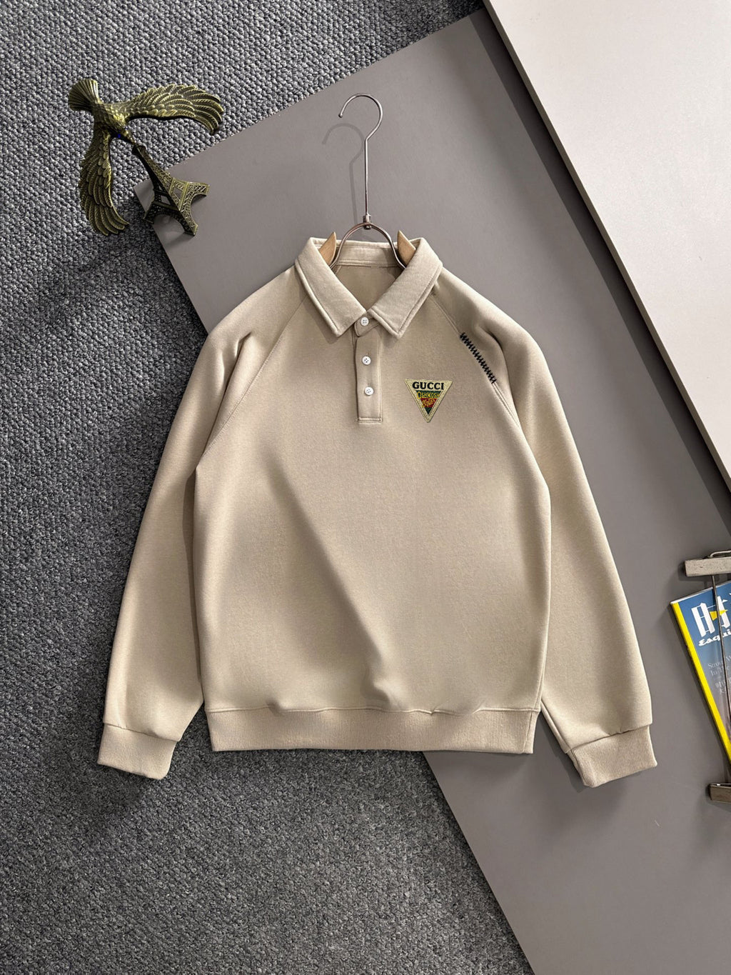 Cream long-sleeve polo shirt with button placket and Gucci logo chest patch