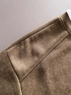 Gucci long-sleeve top sleeve close-up with stitched seams and soft brown fabric