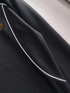 Black sweatshirt panel with white contrast seam piping