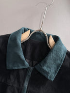 Fendi jacket neckline close-up with teal corduroy collar and button placket