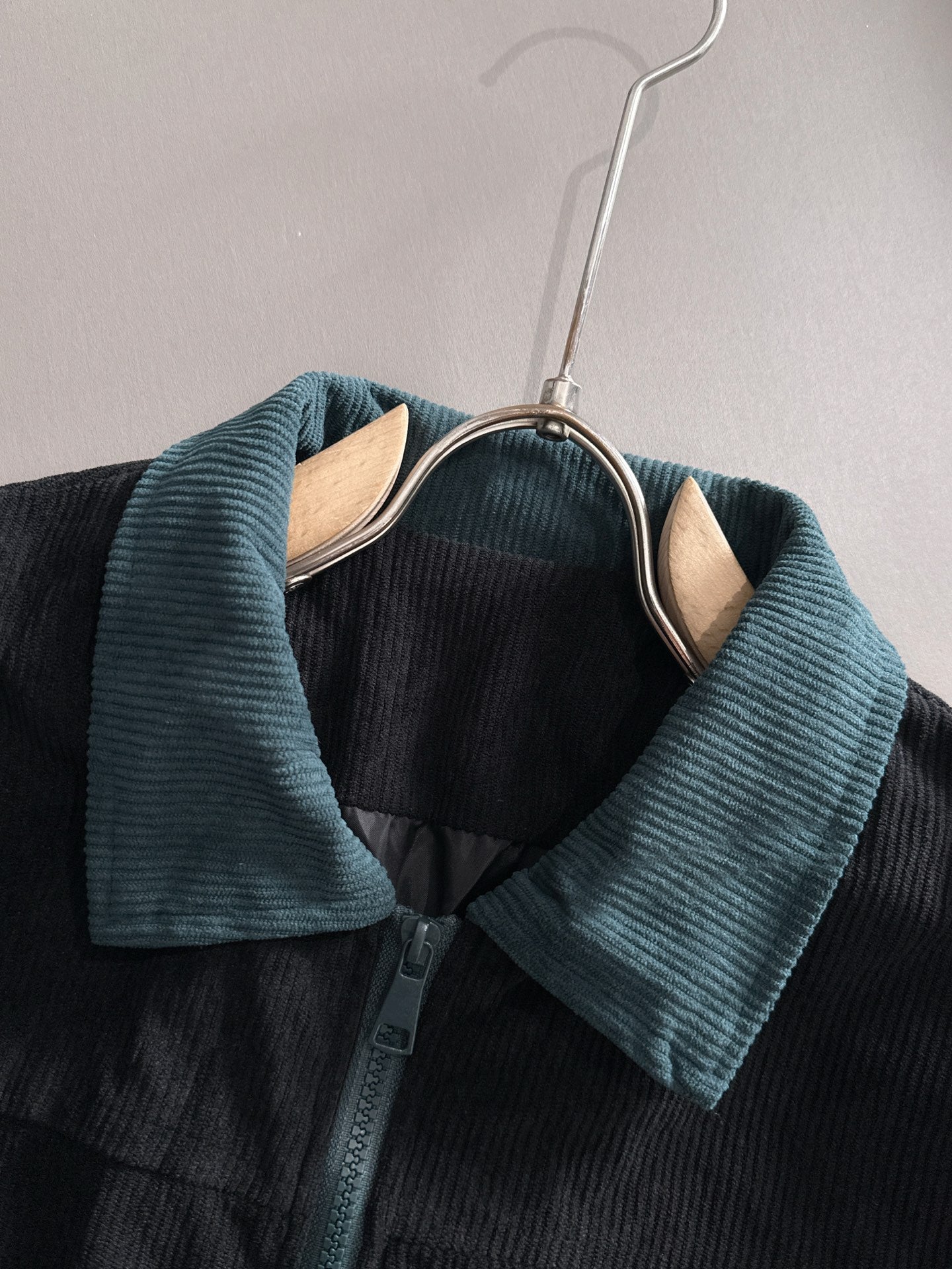 Fendi jacket neckline close-up with teal corduroy collar and button placket