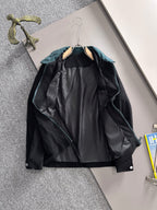 Fendi long-sleeve jacket, black outer shell with teal collar and visible lining