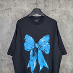 Balenciaga black T-shirt with large blue bow graphic, crew neck