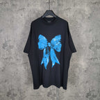 Balenciaga black T-shirt with blue bow graphic at center