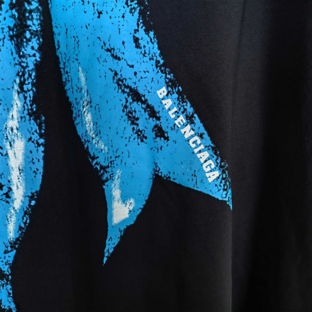 Black graphic T-shirt with blue Balenciaga text on sleeve