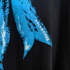 Black graphic T-shirt with blue Balenciaga text on sleeve