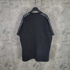 Balenciaga short-sleeve T-shirt, dark with contrast sleeve stripes and crew neck