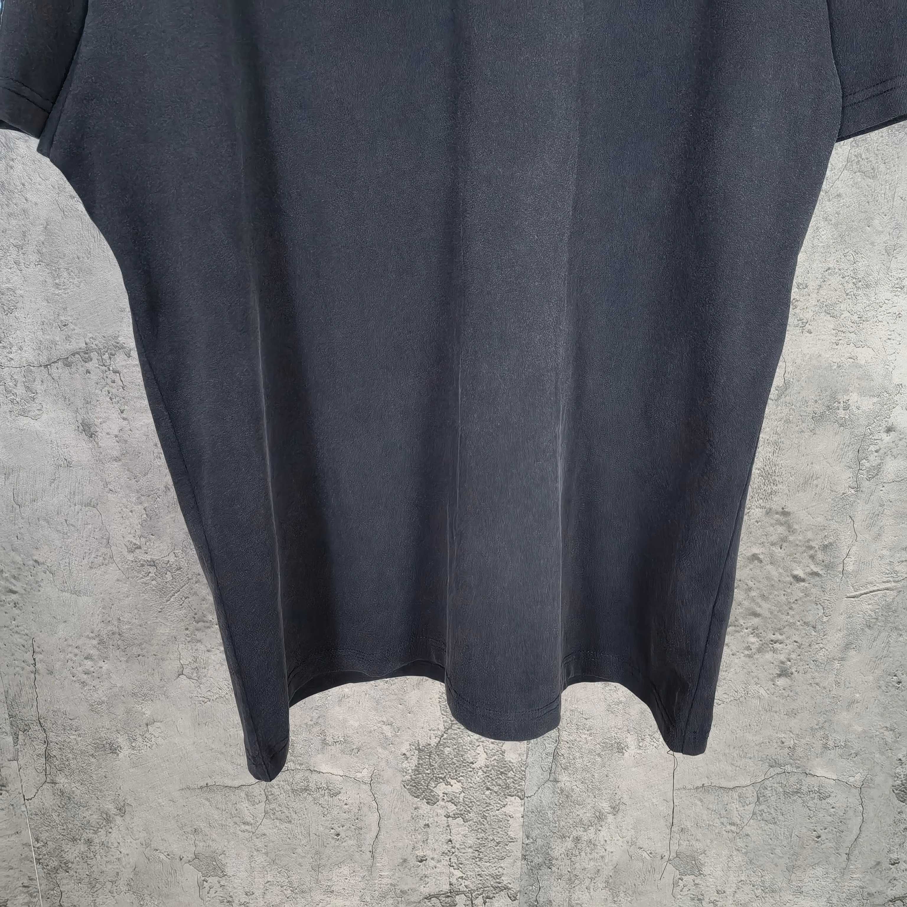 Balenciaga dark shorts with curved hem and vertical seam details