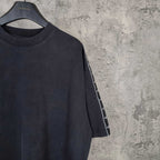 Balenciaga short-sleeve T-shirt neckline detail, dark crew neck and striped sleeve panel