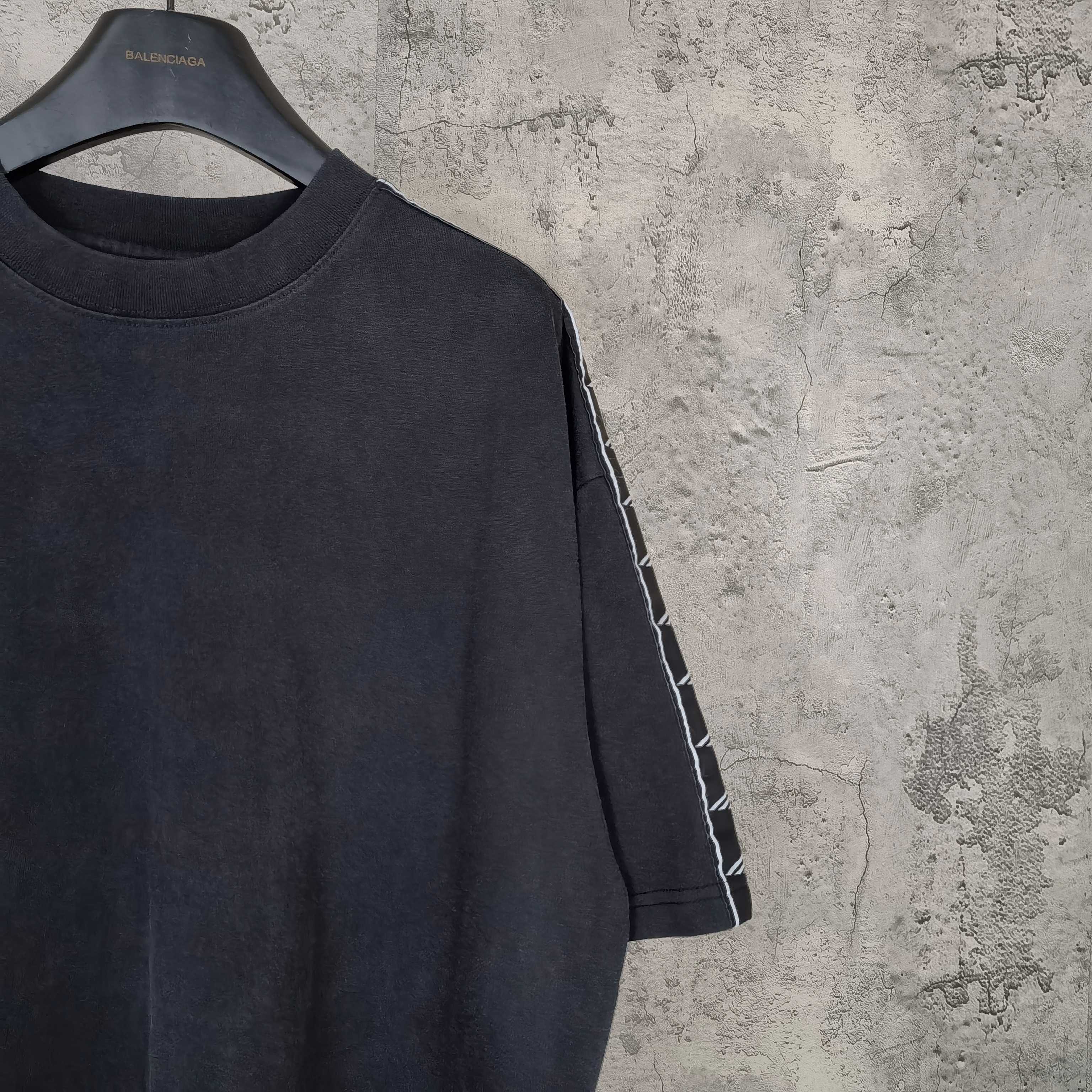 Balenciaga short-sleeve T-shirt neckline detail, dark crew neck and striped sleeve panel