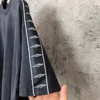 Balenciaga short-sleeve T-shirt sleeve detail, dark fabric with white contrast stripe