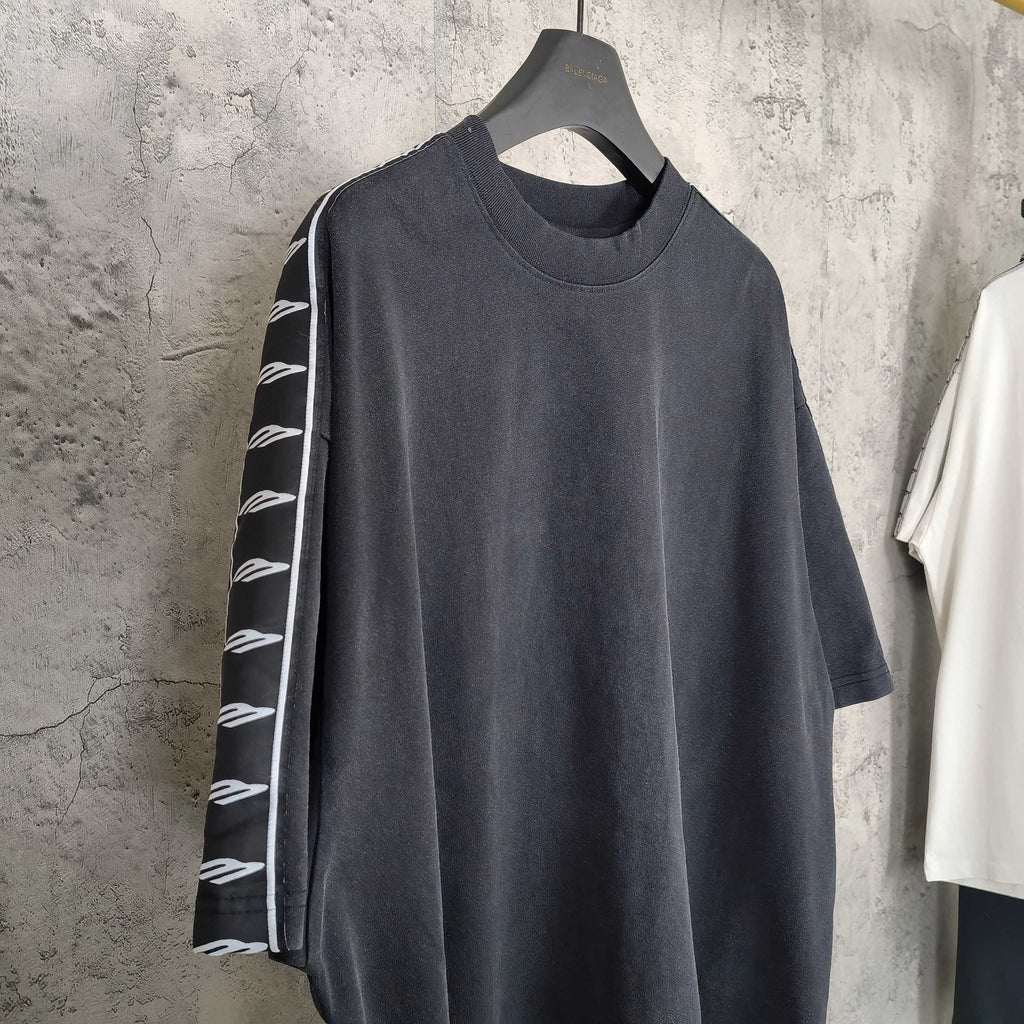 Balenciaga short-sleeve T-shirt on hanger, dark crew neck with striped sleeve panel