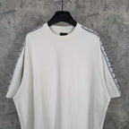 Balenciaga white crewneck T-shirt with patterned stripe trim along both shoulders
