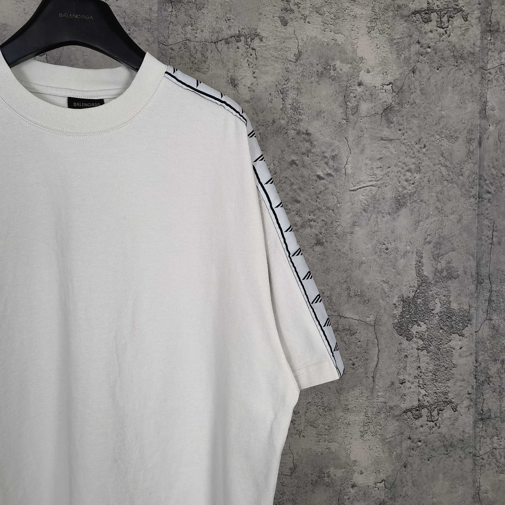 Balenciaga white crewneck T-shirt close-up of shoulder and patterned stripe sleeve trim