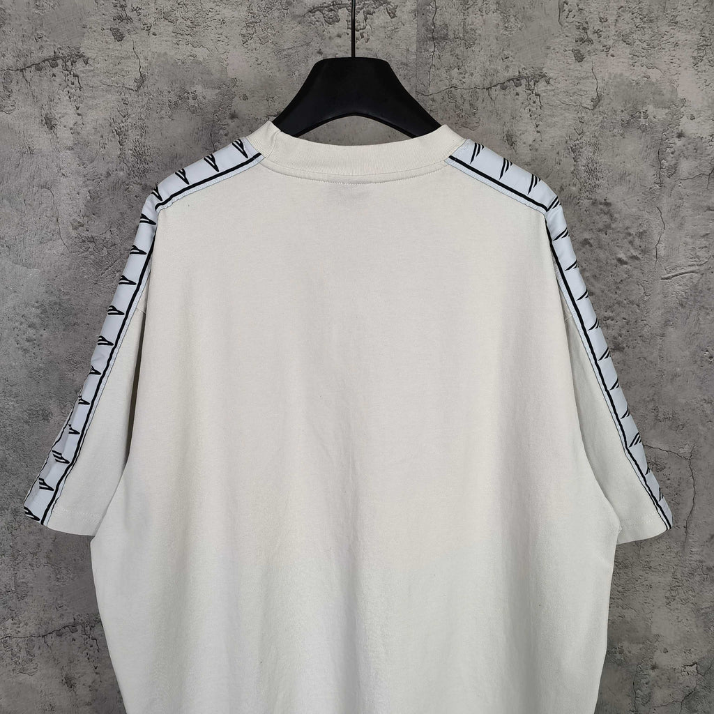 Balenciaga white crewneck T-shirt back view, patterned stripe trim at shoulders