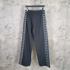 Balenciaga wide-leg pants with elastic waistband and white patterned side stripe