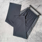 Balenciaga pants set with elastic waist: dark solid pair and dark striped pair