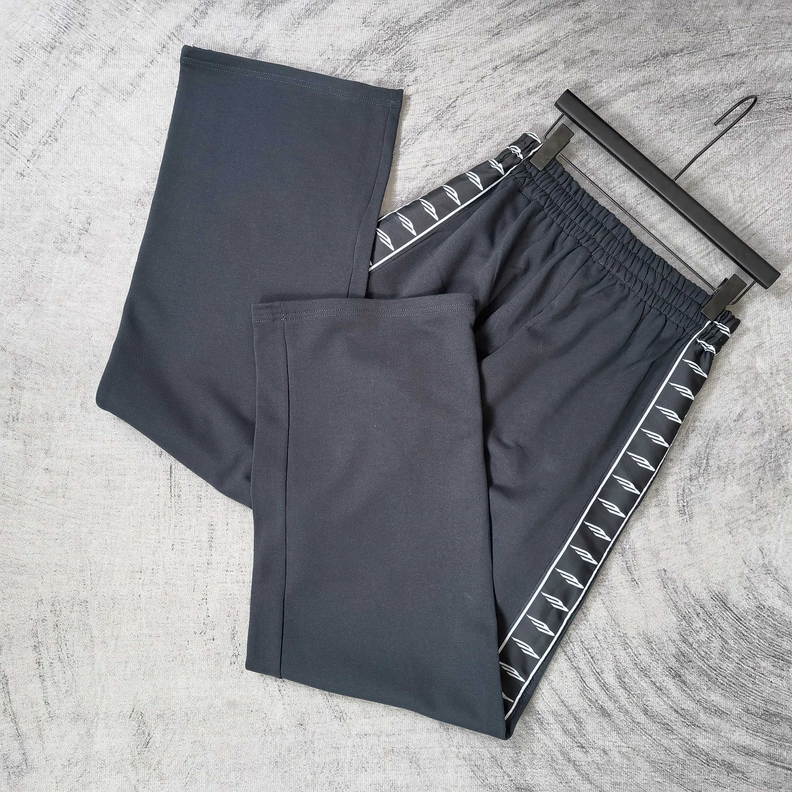 Balenciaga pants set with elastic waist: dark solid pair and dark striped pair