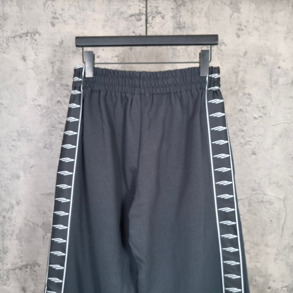 Balenciaga elastic-waist wide-leg pants with white patterned stripe along side seam