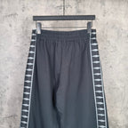 Balenciaga elastic-waist wide-leg pants with white patterned stripe along side seam