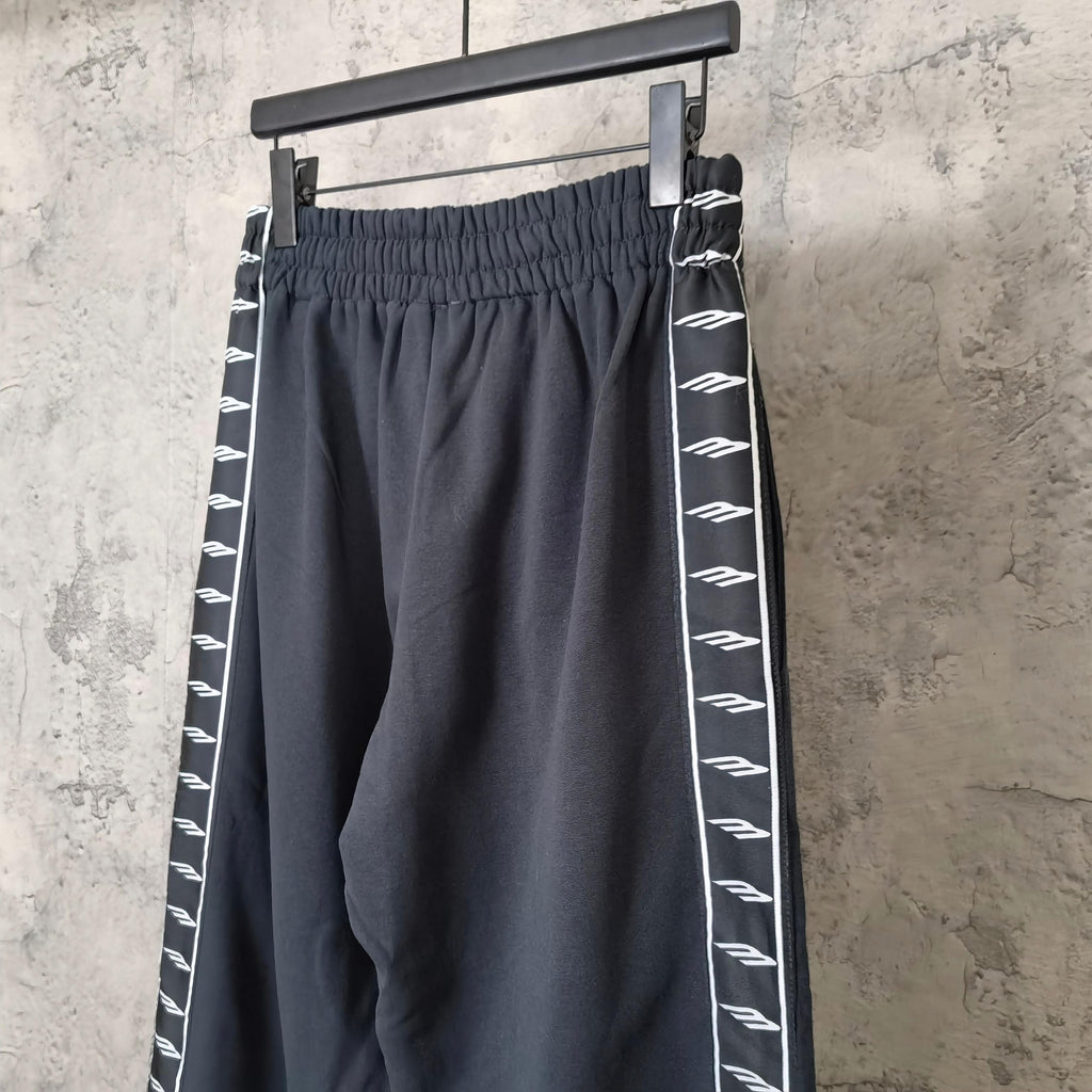 Balenciaga wide-leg pants with elastic waistband and white patterned side stripe