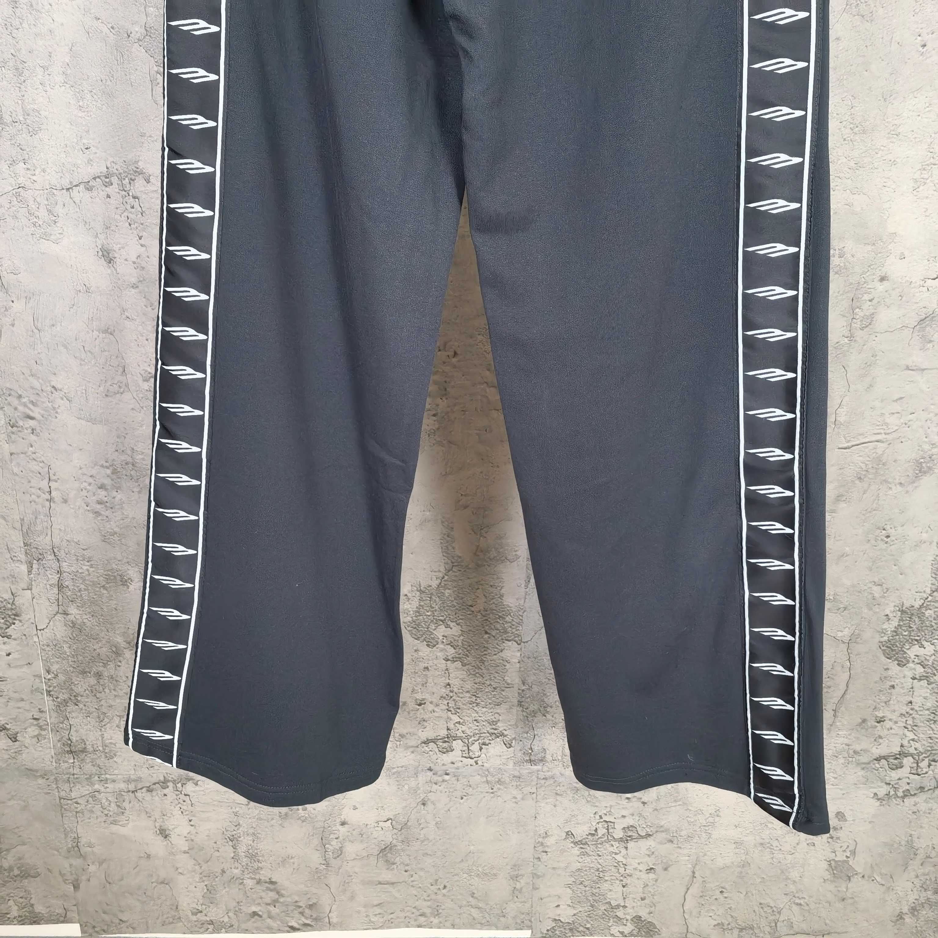 Balenciaga wide-leg pants with white patterned side stripe, dark blue/charcoal fabric