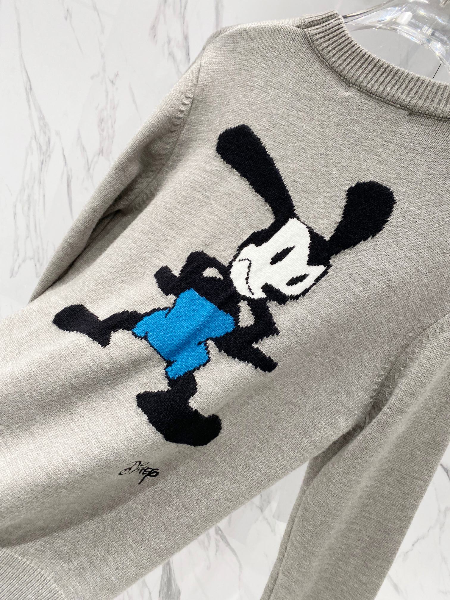 Givenchy sweatshirt sleeve in light gray with Mickey Mouse graphic applique