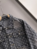 Distressed denim jacket close-up with flap pockets and buttoned front